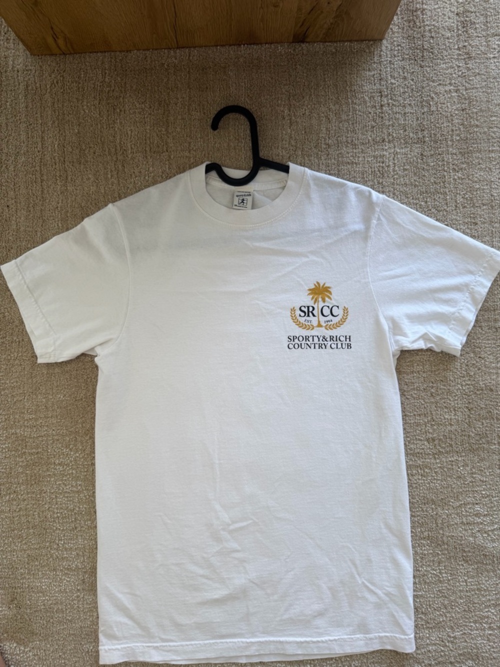 Sporty & Rich White Tee with Gold & Black Country Club Logo